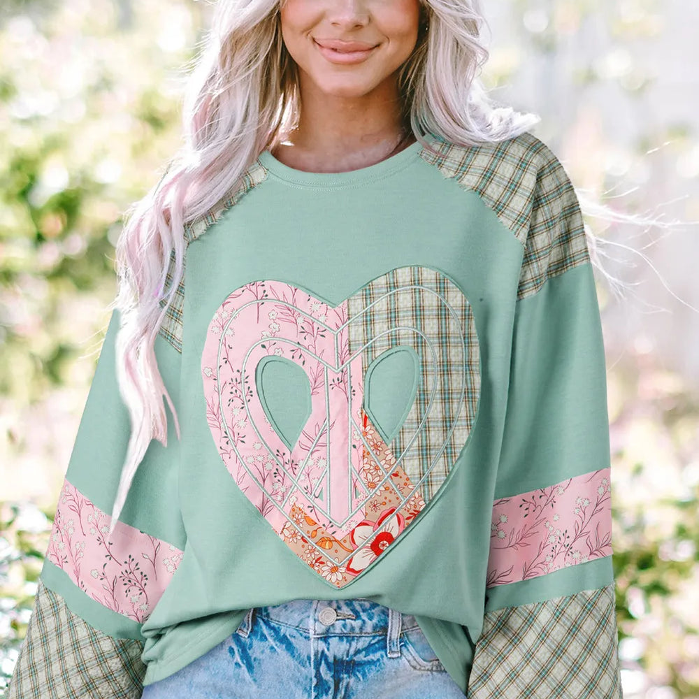 
                      
                        The Patchwork Heart Pullover
                      
                    